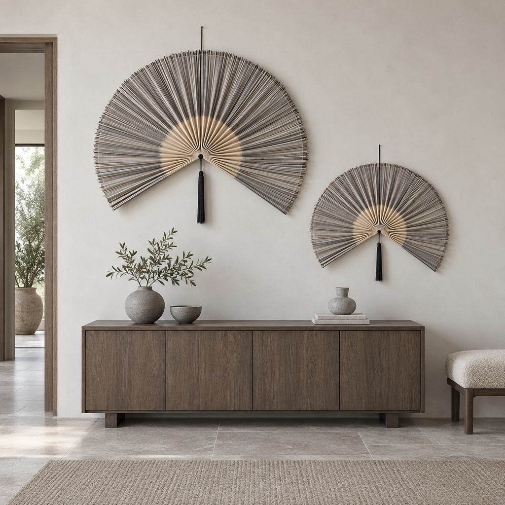 Set of two gradient gray wall fans above an entryway credenza
