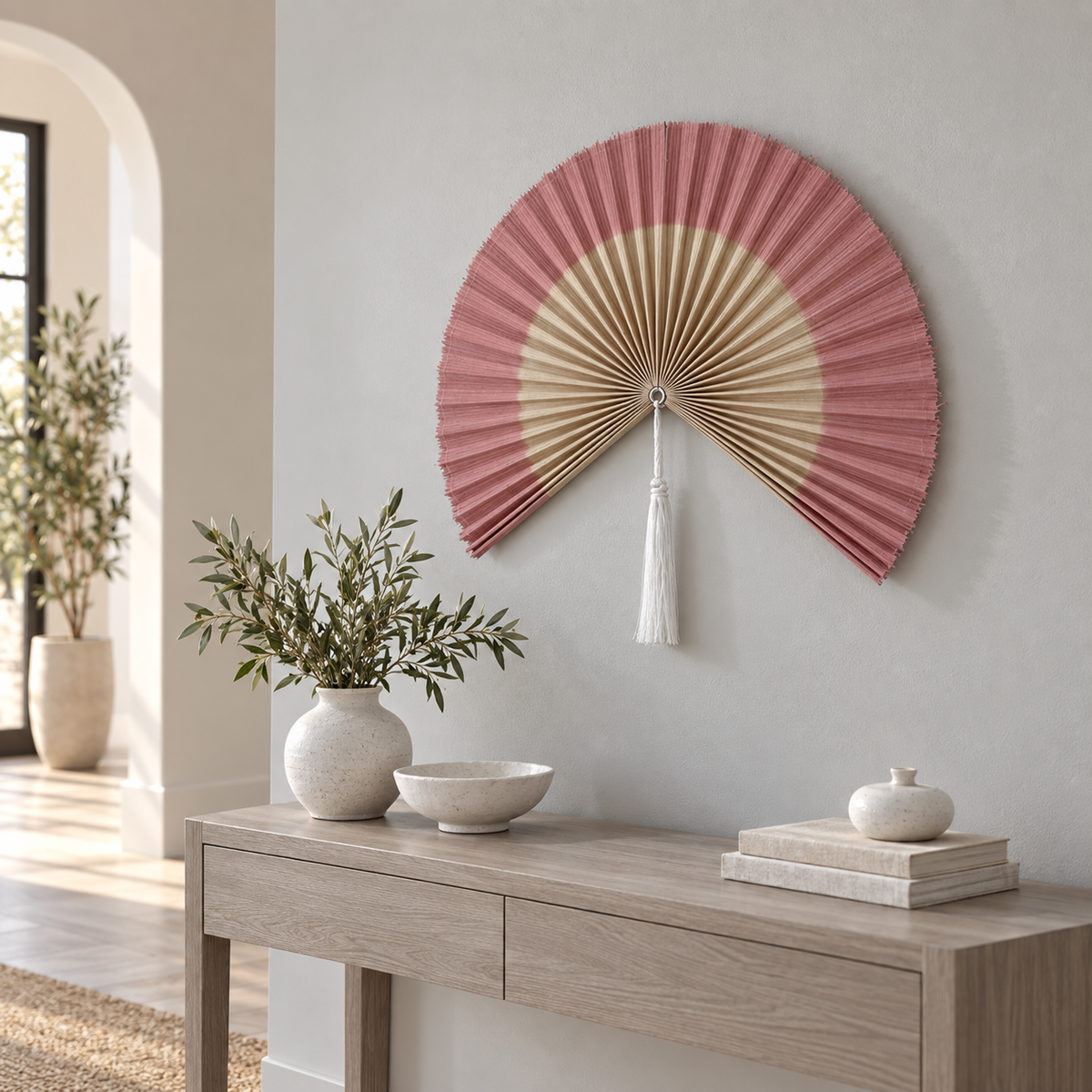 Dusty Pink & Natural woven wall fan shown from an angled view
