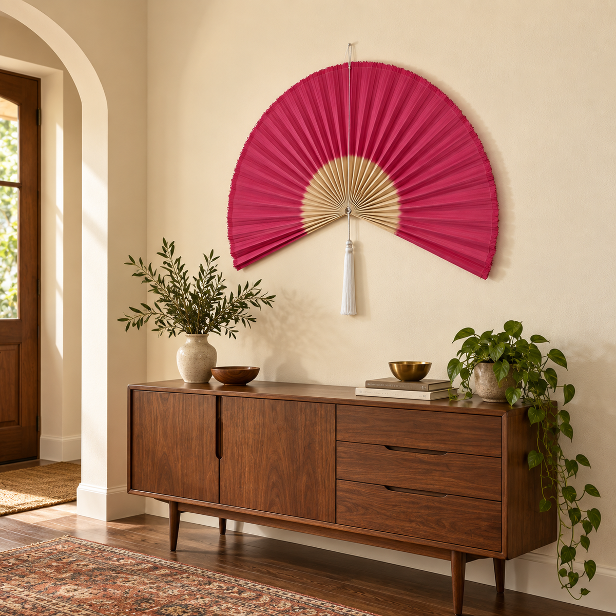 Magenta & Natural woven wall fan shown from an angled view