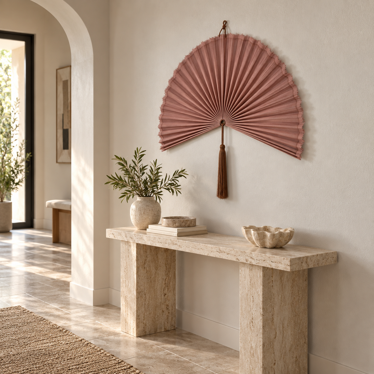 Dusty Blush Pink woven wall fan shown from an angled view