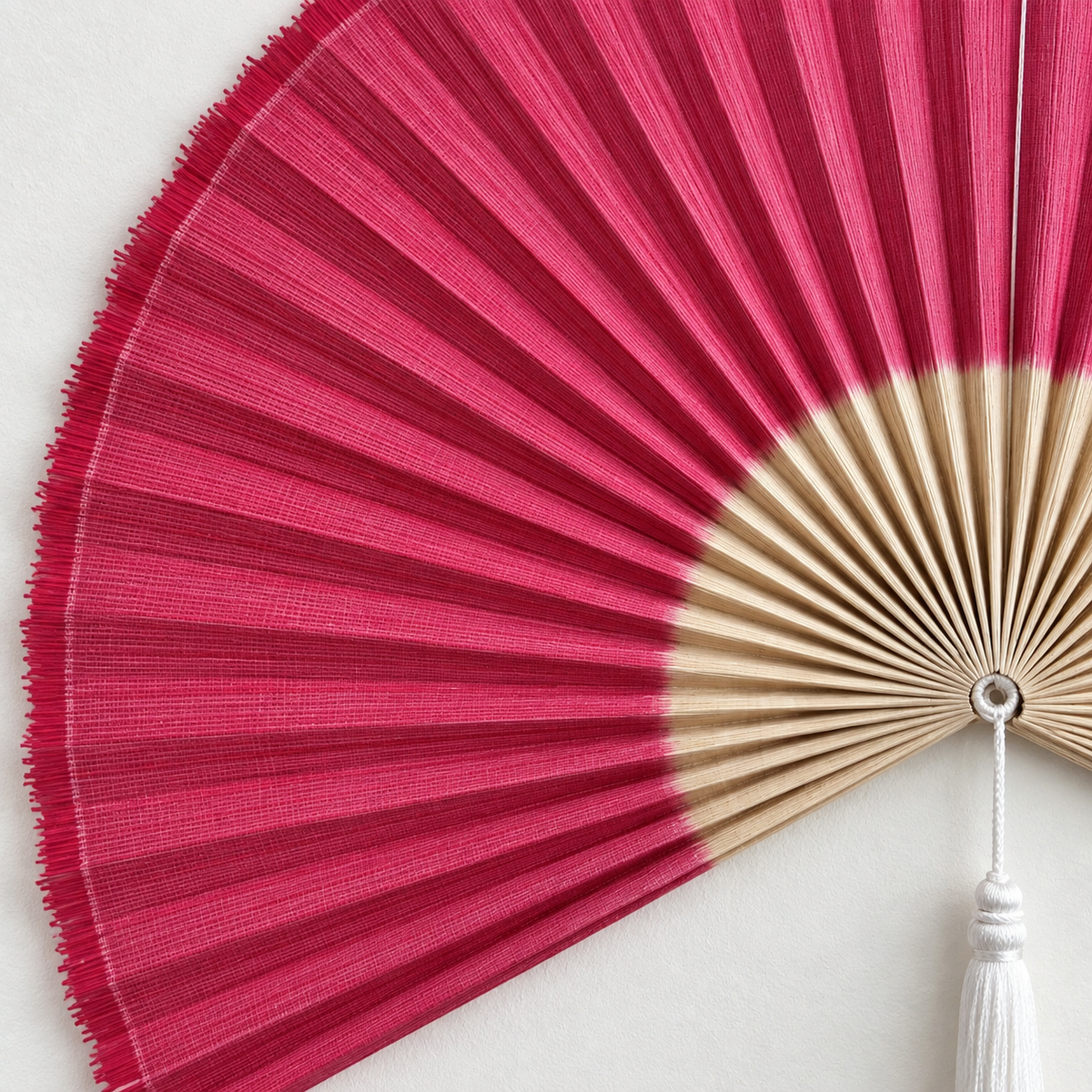 Magenta & Natural woven wall fan texture and tassel detail