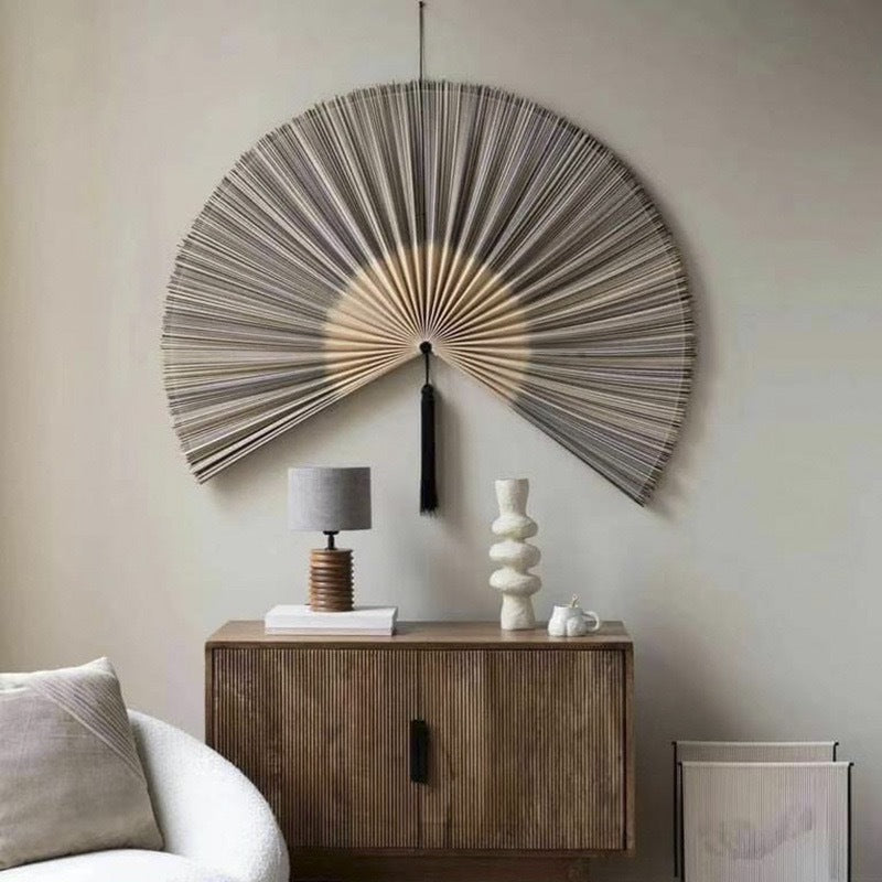 Original product view of a gradient gray bamboo wall fan with black tassel