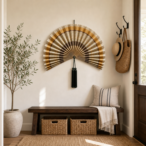 Handcrafted beige brown bamboo folding fan wall decor with dark green tassel, shown open and closed.