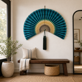 Large teal green bamboo folding fan wall decor with dark tassel, shown open and folded on white background.